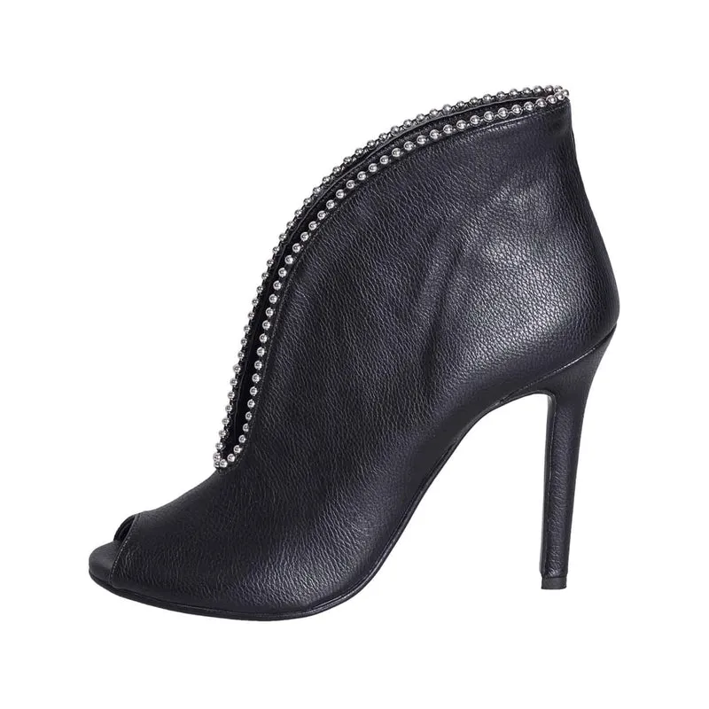 Scarpe spuntate con tacco alto e borchie