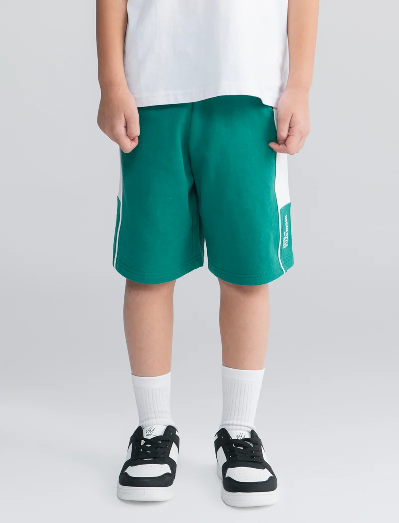 Bermuda in felpa con fasce laterali - Verde